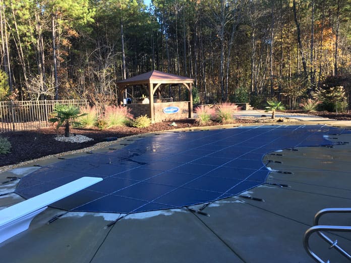 A custom safety cover installed on a pool in Carrboro