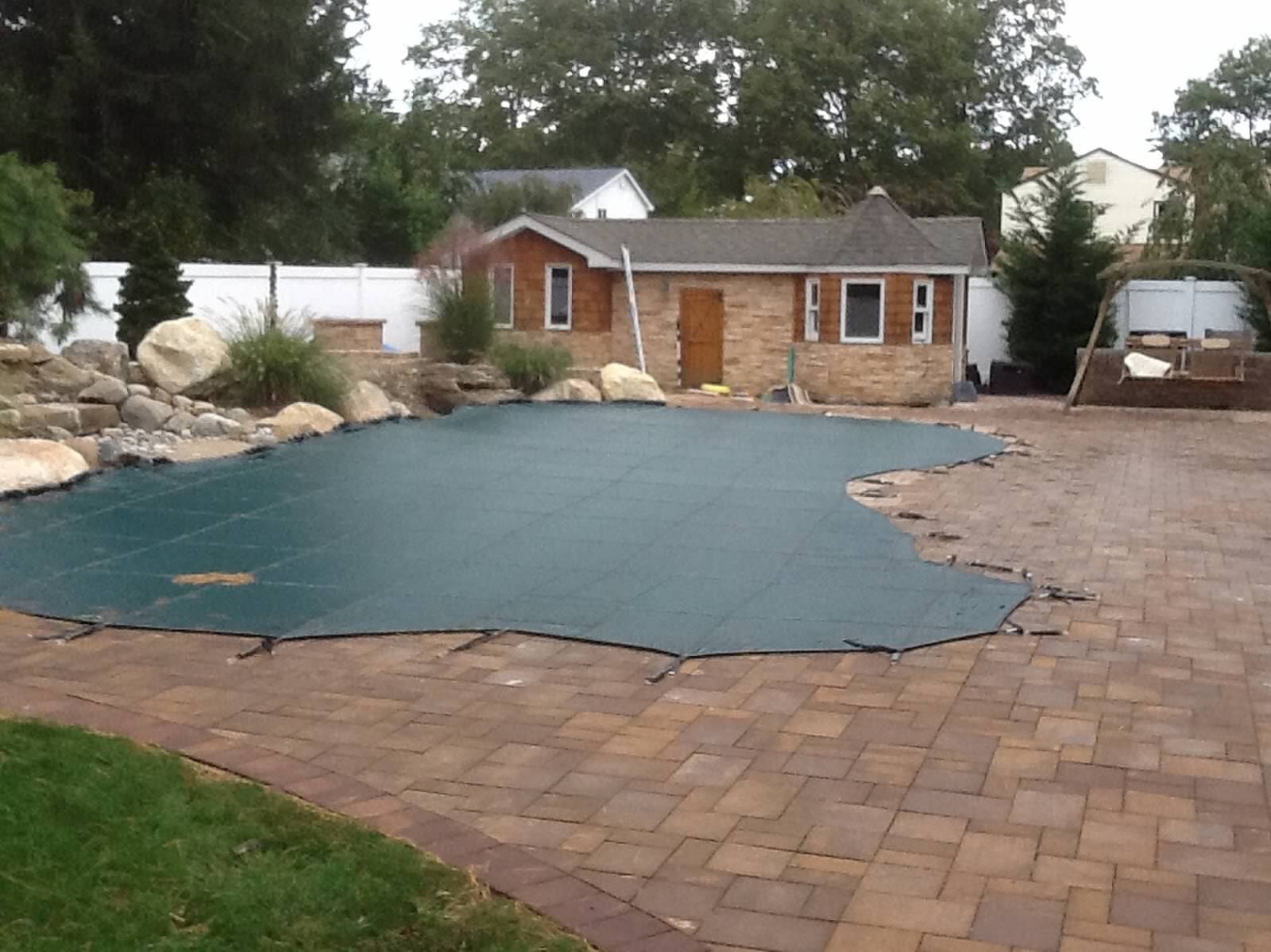 A custom safety cover installed on a pool in Cary