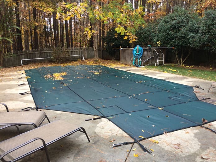 A custom safety cover installed on a pool in Durham