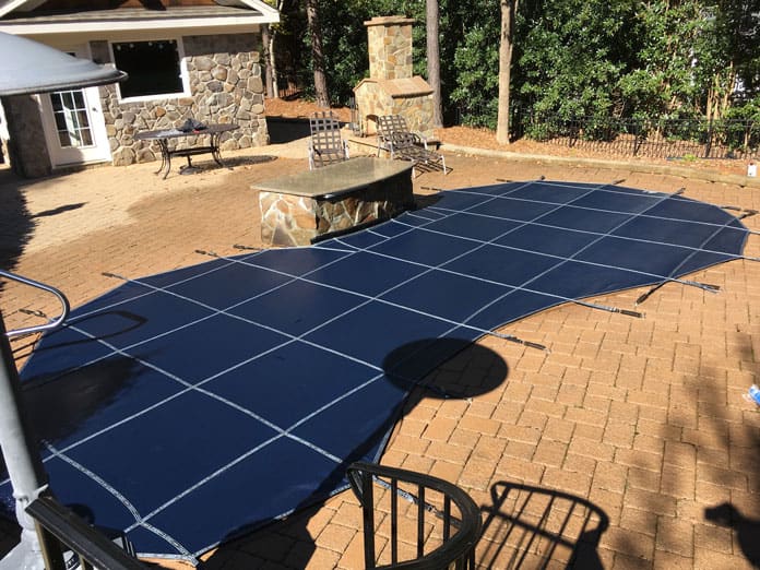 A custom safety cover installed on a pool in Knightdale